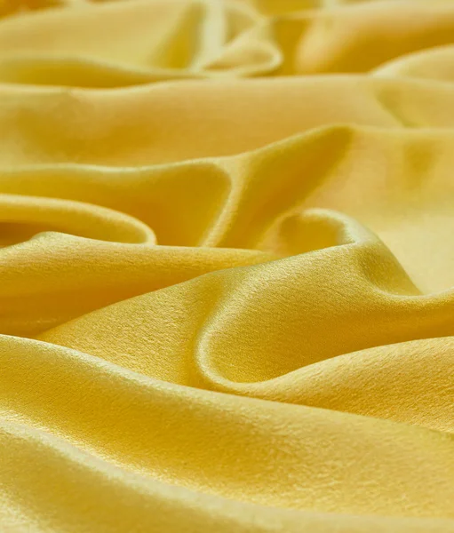 Draperie zlatého saténu tkaniny — Stock fotografie