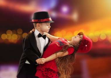 Lovely little boy and girl dancing clipart