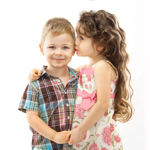 Little girl whispering something to boy — Stock Photo, Image