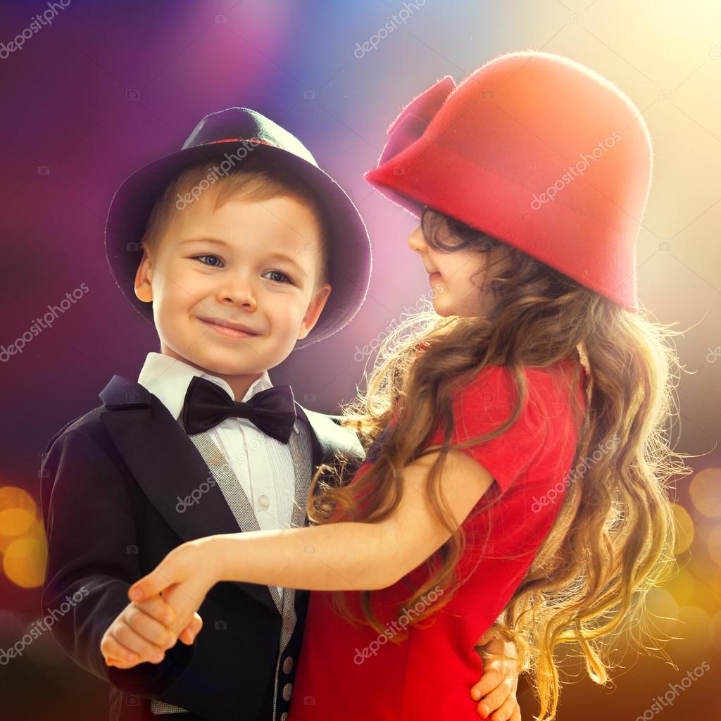 Lovely little boy and girl dancing — Stock Photo © SvetaOrlova 40271825