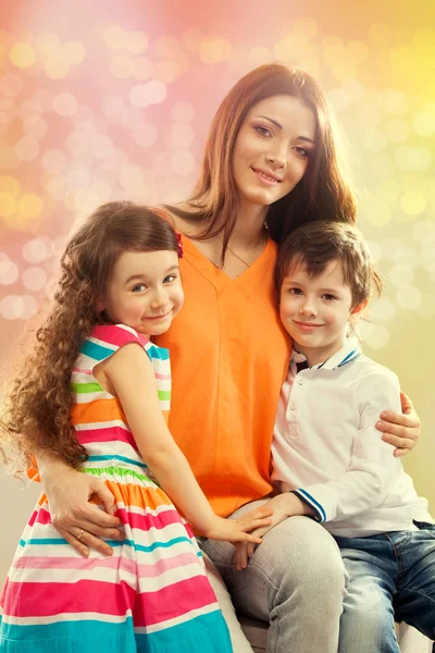 Happy mother with her daughter and son — Stock Photo, Image