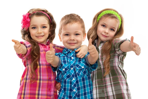 Cute fashion kids showing thumbs up — Stock Photo, Image