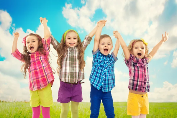 Happy kids jumping together — Stock Photo, Image