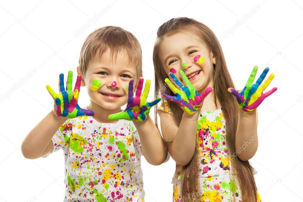 Girl and boy with hands painted in colorful paint