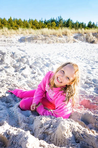 Little Girl Laying Pink Clothes Beach Sand Sunny Day Swimming — Stock Photo, Image