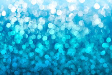 Blue gradient glitter abstract background with bokeh defocused.