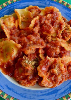 Spinach and ricotta ravioli on a colorful plate