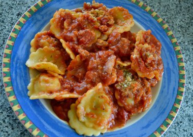 Spinach and ricotta ravioli on a colorful plate