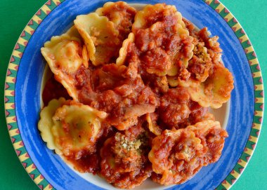Spinach and ricotta ravioli on a colorful plate