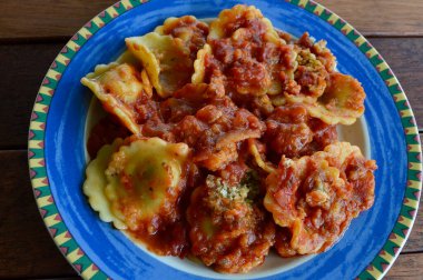 Spinach and ricotta ravioli on a colorful plate
