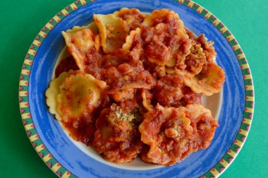 Spinach and ricotta ravioli on a colorful plate