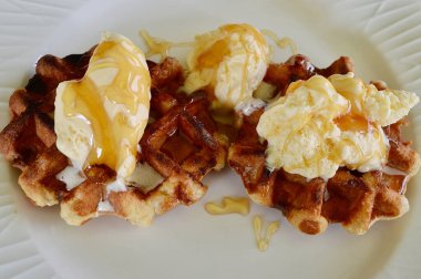 Belgian waffles with extra creamy ice cream and honey