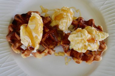 Belgian waffles with extra creamy ice cream and honey