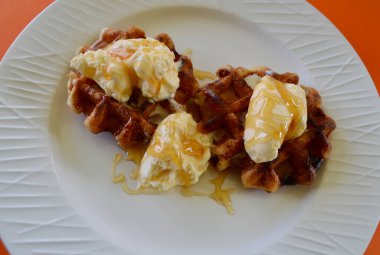 Belgian waffles with extra creamy ice cream and honey