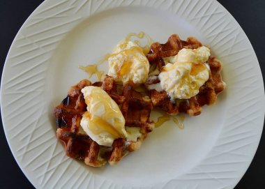 Belgian waffles with extra creamy ice cream and honey