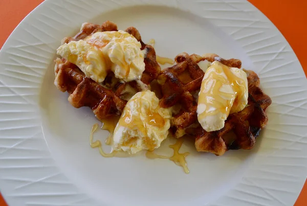 Belgian waffles with extra creamy ice cream and honey