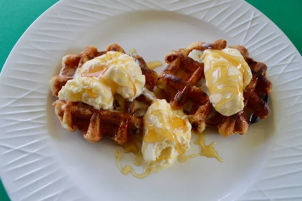 Belgian waffles with extra creamy ice cream and honey