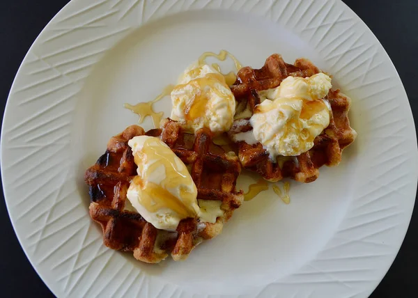Belgian waffles with extra creamy ice cream and honey