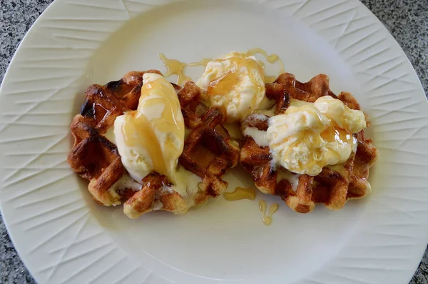 Belgian waffles with extra creamy ice cream and honey