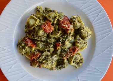 Spinach and ricotta tortellini with a pesto sauce