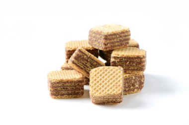 square chocolate wafer biscuits isolated on white background, bakery and snack concept