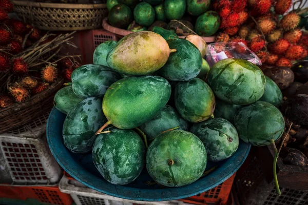 Fruit shop in Thailand. Fruit market in Indonesia Bali island. Street bazaar in Asia. Sale of fresh fruits and vegetables at the market in Thailand. A small grocery store on the street of Bali island