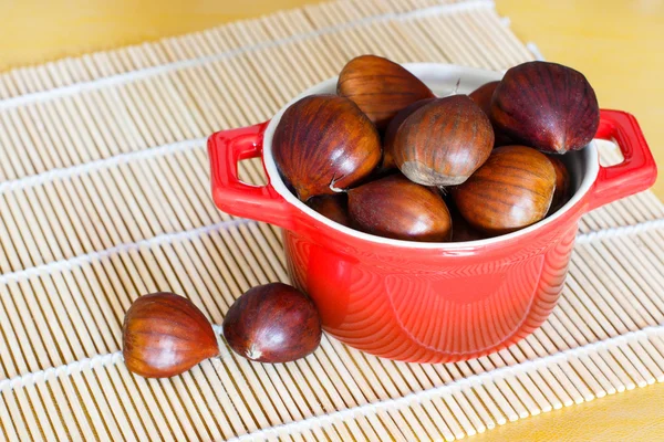 Chestnut in red bowl — Stock Photo, Image