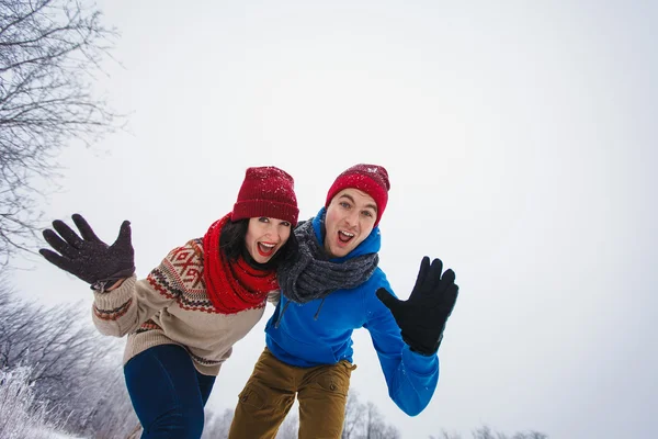 Guy and girl walk and have fun in the forest — Stock Photo, Image