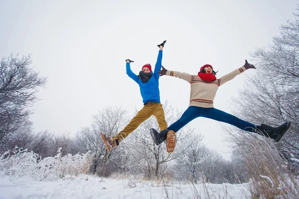 Guy and girl walk and have fun in the forest — Stock Photo, Image