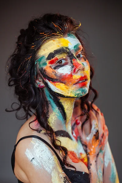 Paint on the face of a young girl — Stock Photo, Image