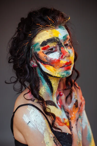 Paint on the face of a young girl — Stock Photo, Image