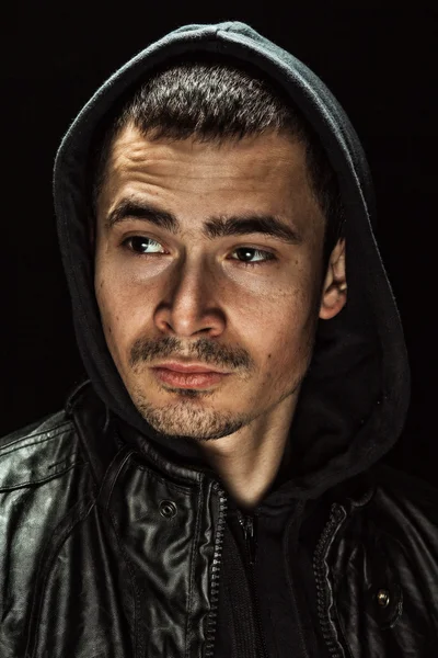 Brutal portrait of a young man in a hood — Stock Photo, Image