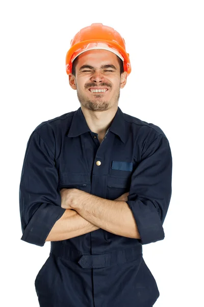 Witziger Arbeiter mit Helm und Rührung im Gesicht — Stockfoto