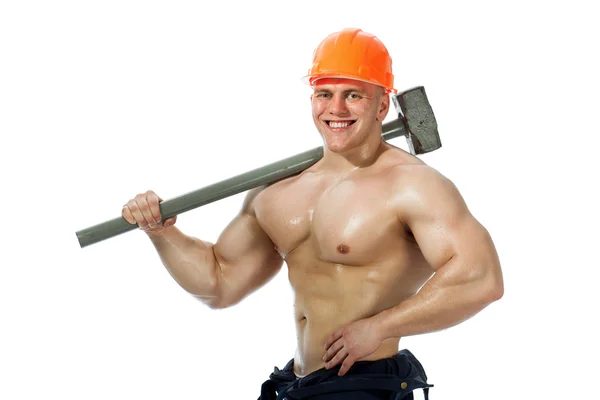 Ung och vacker builder med en slägga och sexig kropp — Stockfoto