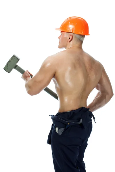 Ung och vacker builder med en slägga och sexig kropp — Stockfoto