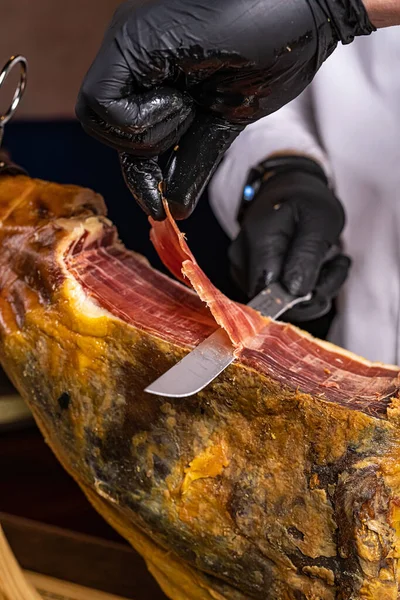 Girl Cuts Jamon Selective Focus Man Cuts Meat Prosciutto Ham Stockbild
