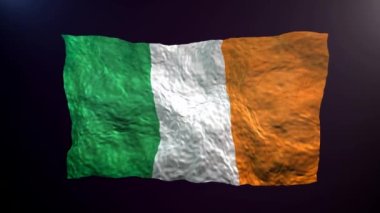 Karanlık arka planda İrlanda bayrağı sallıyor.