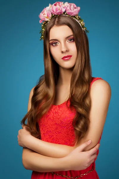 Girl with a wreath of pink flowers on her head — Stock Photo, Image