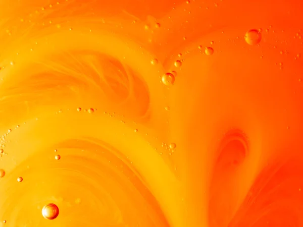Gele Oranje Achtergrond Met Belletjes Een Patroon Gemaakt Van Vloeibare — Stockfoto
