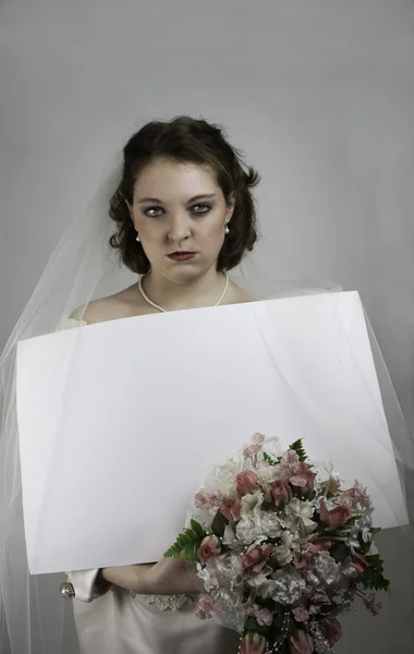 Pretty young bridezilla holding blank sign — Stock Photo, Image