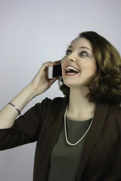 Pretty young professional woman using cell phone — Stock Photo, Image