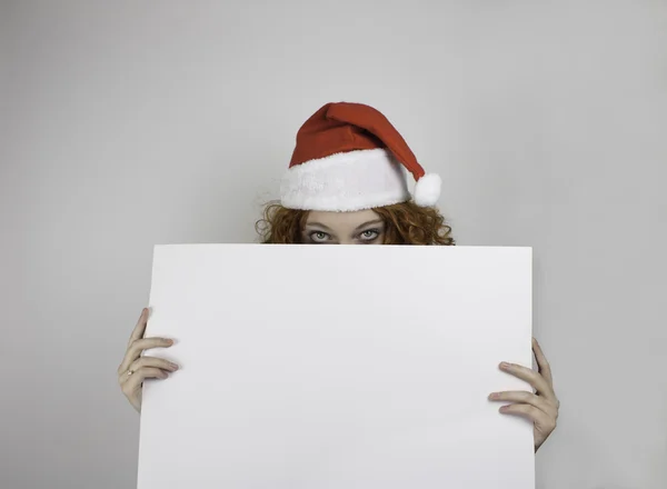 Young woman wearing Santa hat — Stock Photo, Image