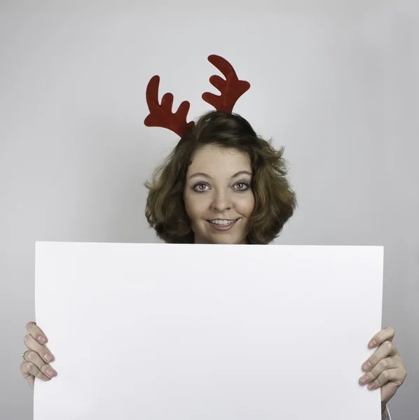 Young woman wearing antlers — Stock Photo, Image