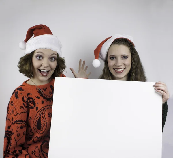 Two women holding blank sign — Stock Photo, Image