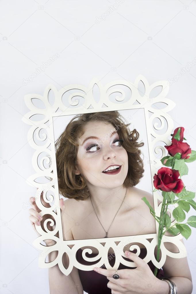 Woman posing with picture frame