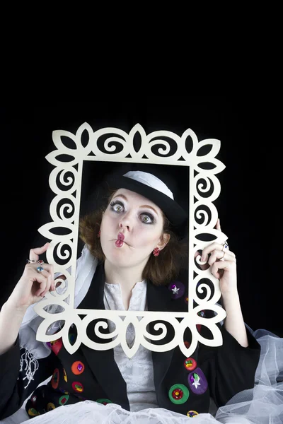 Woman coming out of picture frame — Stock Photo, Image