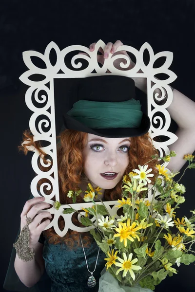 Woman posing with picture frame — Stock Photo, Image