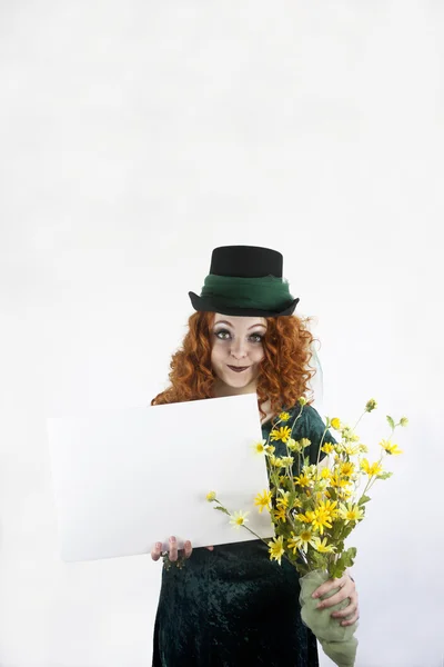 Girl in green with blank sign — Stock Photo, Image