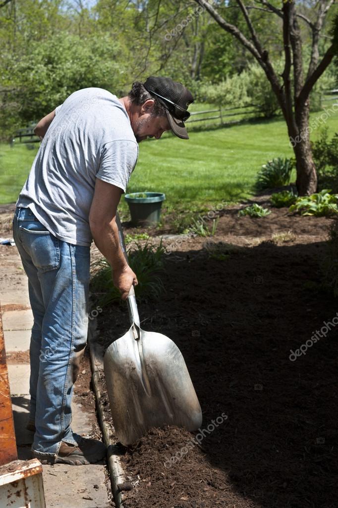 Man with shovel landscaping — Stock Photo © cindygoff 46098119
