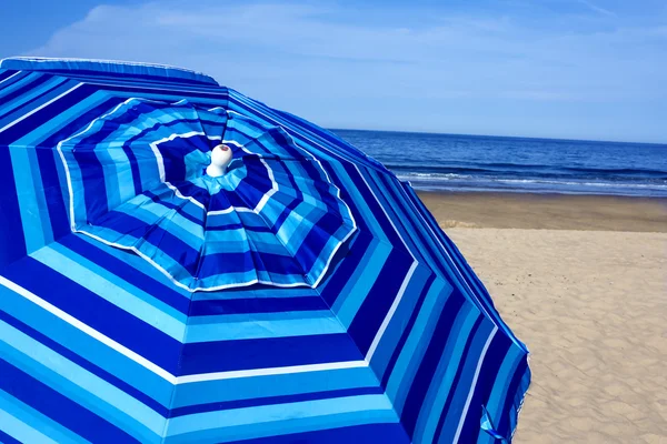 Blue striped beach umbrella — Stock Photo, Image